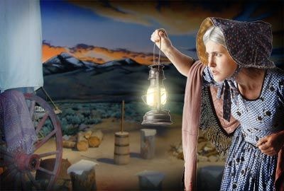 Buffalo Interpretive Center living history display with woman holding lantern